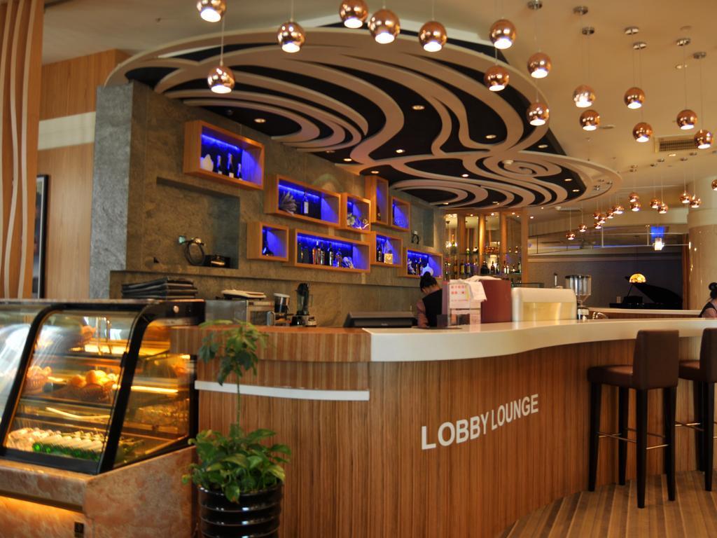 Evergreen Plaza Hotel - Tajnan Kültér fotó Lobby Lounge